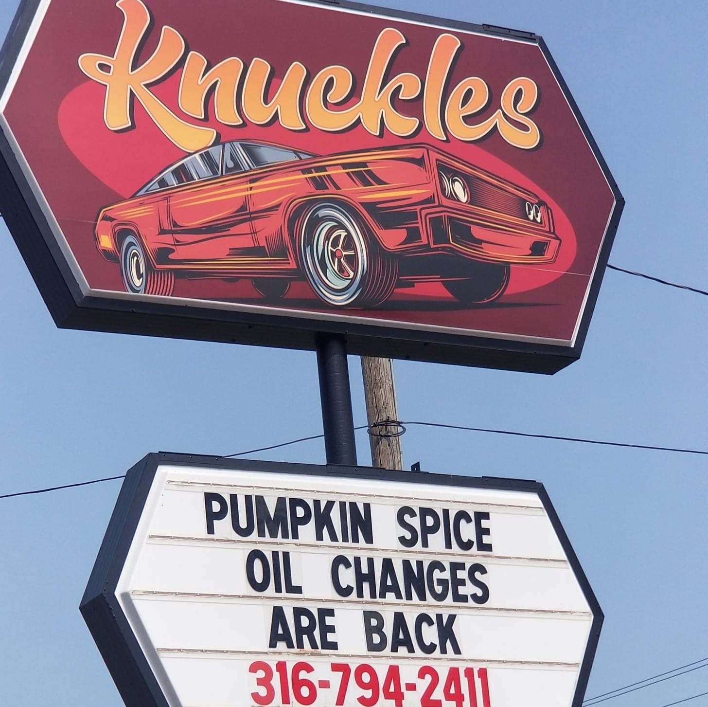 Knuckles Automotive Service roadside sign